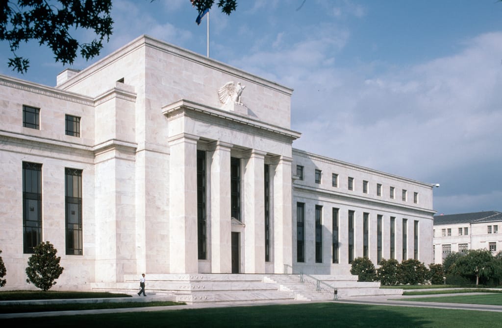 Federal Reserve Signals Caution Amid Persistent Inflation Pressures